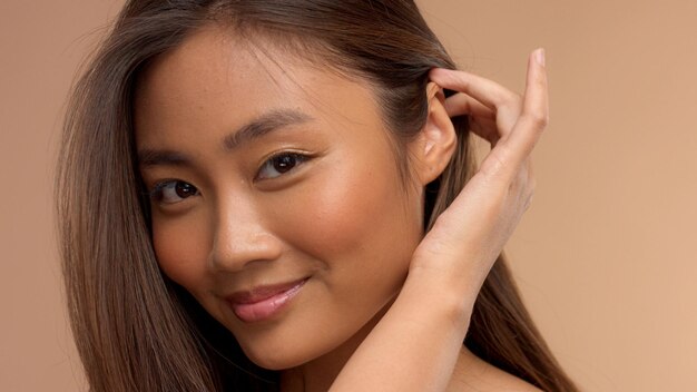 Closeup portrait of asian thai japanese model take away hair from face