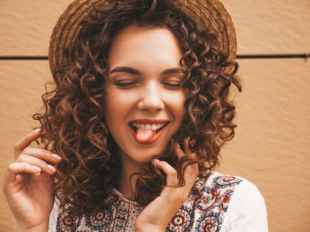 Free photo closeup portrait of beautiful smiling model with afro curls hairstyle dressed in summer hipster white dress.