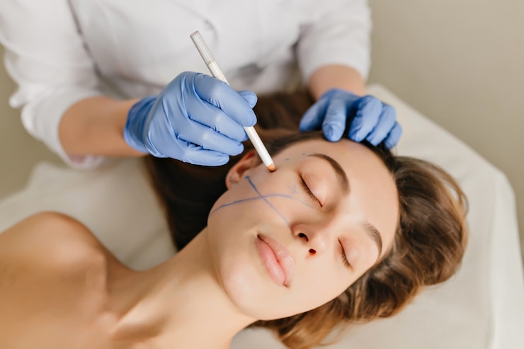 Free Photo closeup portrait of beautiful woman during the preparation to cosmetology therapy in beauty salon. professional dermatology procedures, lifting, rejuvenation