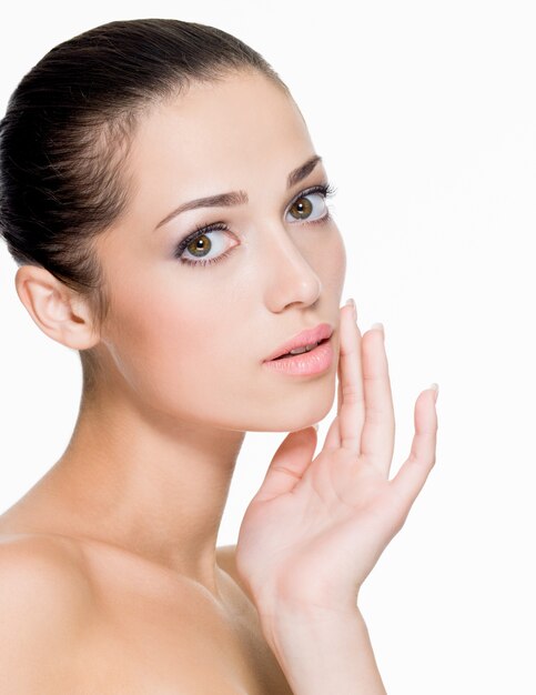 Closeup portrait of beautiful woman with fresh skin of face