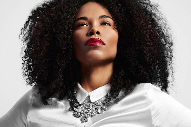 Closeup portrait of black woman with curly brunette hair