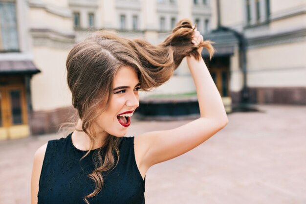 Closeup portrait of effective girl on street