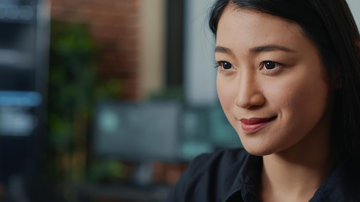 Free Photo closeup portrait of focused asian coder writing online cloud computing code and smiling sitting at desk in database development agency. friendly app developer working casually computing big data.