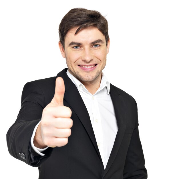 Closeup portrait of happy businessman shows thumbs up isolated on white.