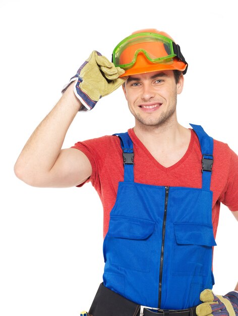 Closeup portrait of happy handyman in uniform isolated on  white background