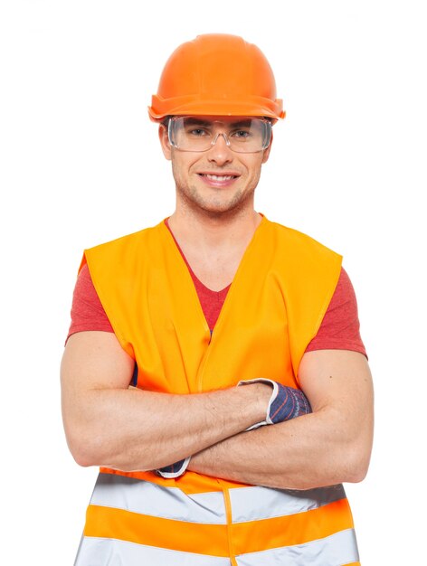 Closeup portrait of happy handyman in uniform isolated on white