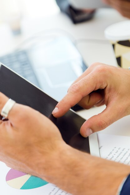 closeup portrait of office worker hands with tablet