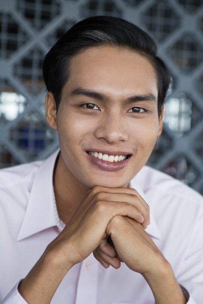 Closeup Portrait of Smiling Young Asian Man