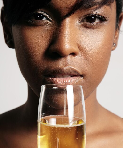 Closeup portrait of a woman drinking from champagne glass closeup