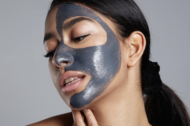 Closeup portrait of woman with facial mask