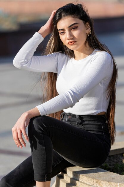 Closeup portrait of young beautiful girl at the street High quality photo