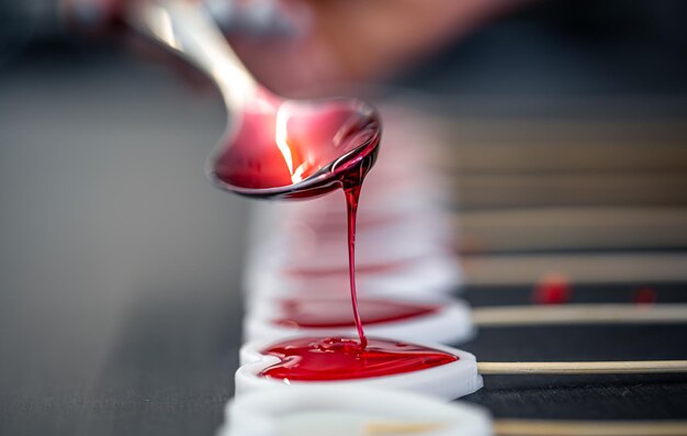 Closeup the process of making lollipops from natural ingredients