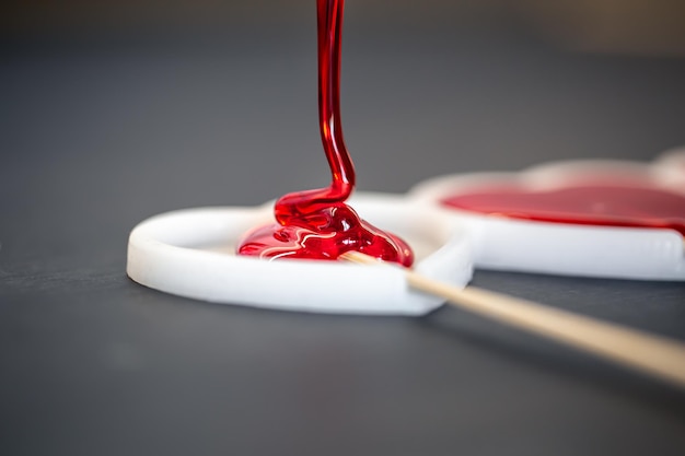 Closeup the process of making lollipops from natural ingredients