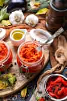 Free photo closeup of raw ajvar on the table with vegetables and sauces on the background