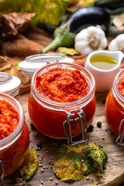 Closeup of raw ajvar on the table with vegetables and sauces