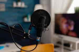 Free photo closeup of recording microphone in home studio. professional live broadcast equipment to record content on social media. electronic audio livestream technology on desk. podcast instrument.