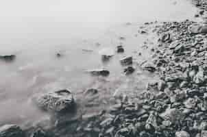 Free photo closeup of rocks at the coast of the sea