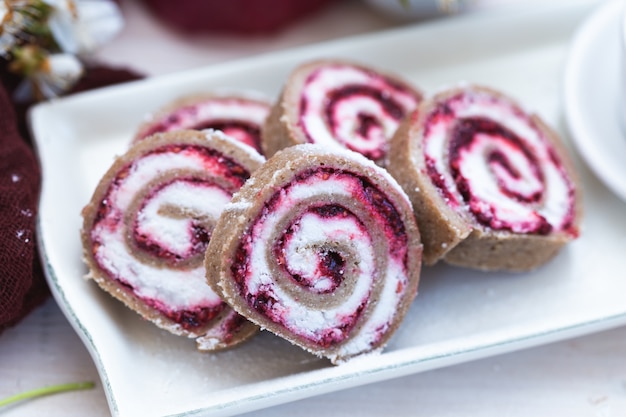 Closeup selective focus shot of tasty looking raspberry rolls with coconut butter