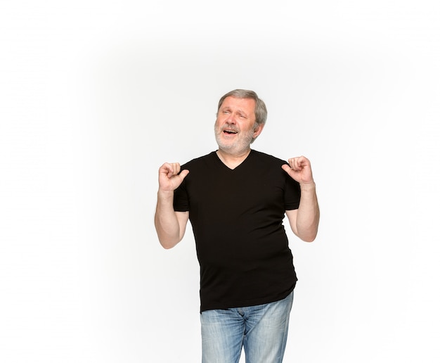 Closeup of senior man's body in empty black t-shirt isolated on white background. Mock up for disign concept