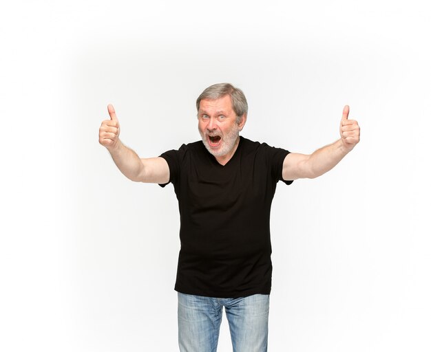 Closeup of senior man's body in empty black t-shirt on white.