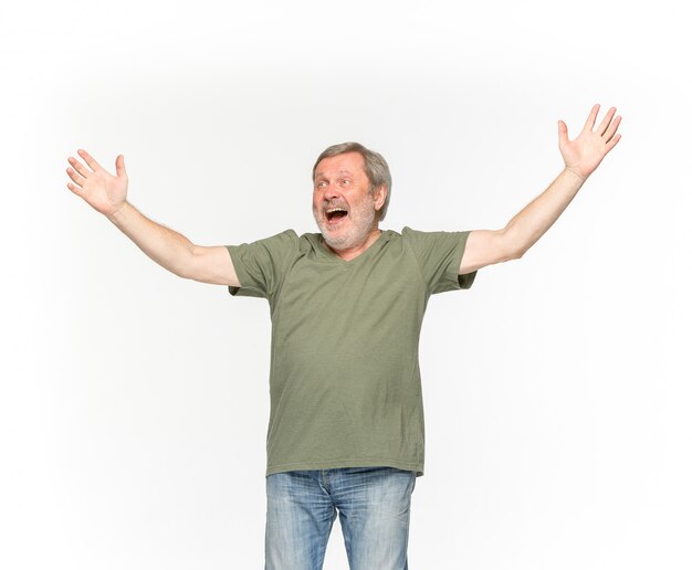 Closeup of senior man's body in empty green t-shirt isolated on white background. 