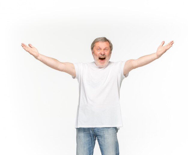 Closeup of senior man's body in empty white t-shirt isolated on white background. 