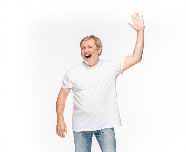 Closeup of senior man's body in empty white t-shirt isolated on white space. Mock up for disign concept