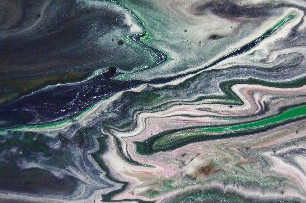 Closeup shot of abstract patterns created with bright paints mixed in the water