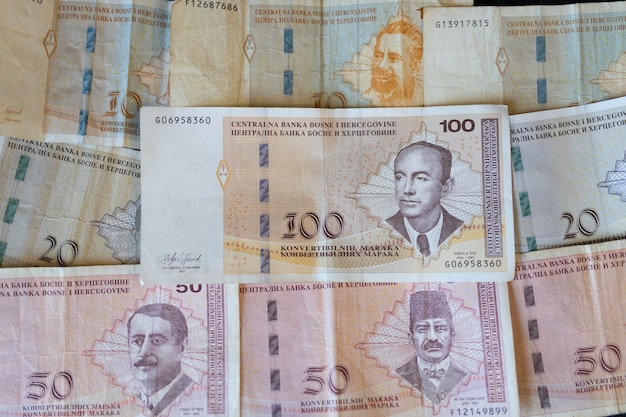 Closeup shot of the banknotes of Bosnia and Herzegovina currency spread on the surface