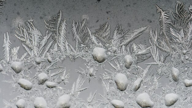 Closeup shot of beautiful frost patterns and textures on a glass