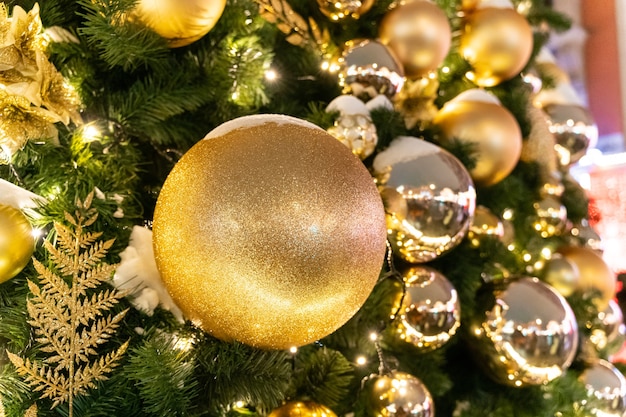 Closeup shot of beautiful ornaments on a Christmas tree