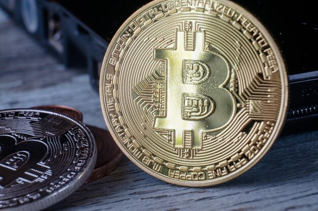 Closeup shot of a bitcoin in a wooden surface