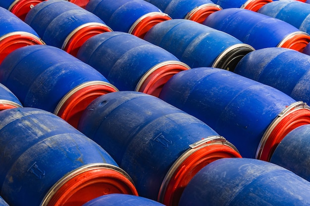 Free photo closeup shot of blue barrels in the factory