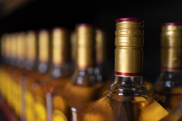 Closeup shot of the bottles of tequila on a black background