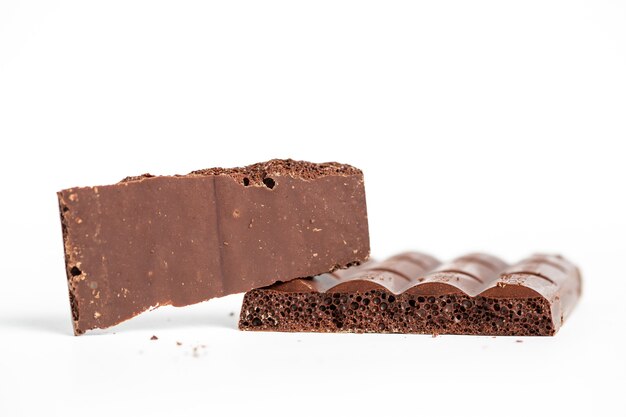 Closeup shot of bubble chocolate pieces isolated on a white background