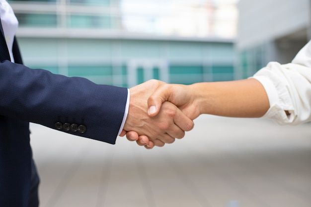 Closeup shot of business handshake. Cropped shot of two people wearing formal suits shaking hands. Business handshake concept