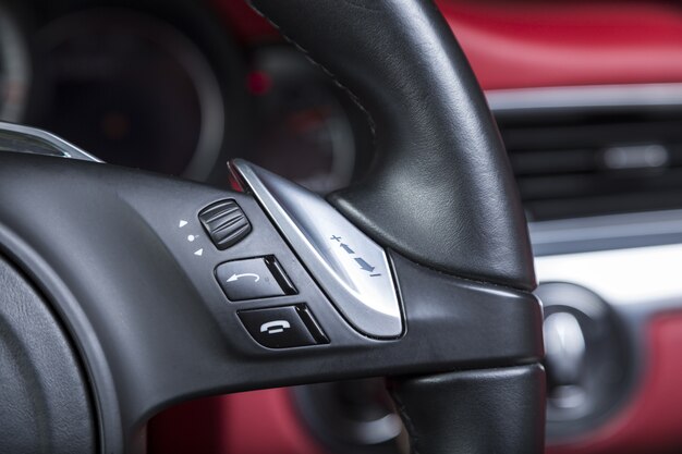 Closeup shot of call buttons on the steering wheel of a modern car