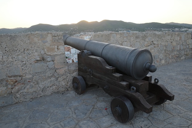 Closeup shot of a cannon in a fort