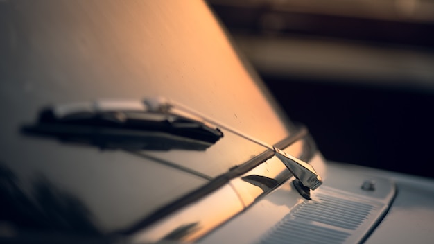 Closeup shot of car wiper with a sunset background