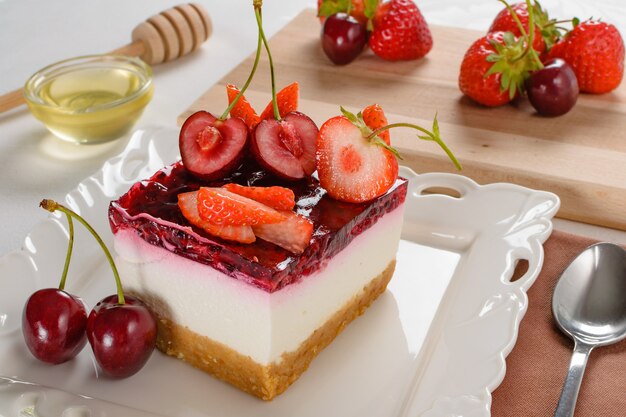 Closeup shot of a cheesecake with berries on top of it