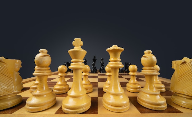 Closeup shot of a chessboard made of brown and black pieces