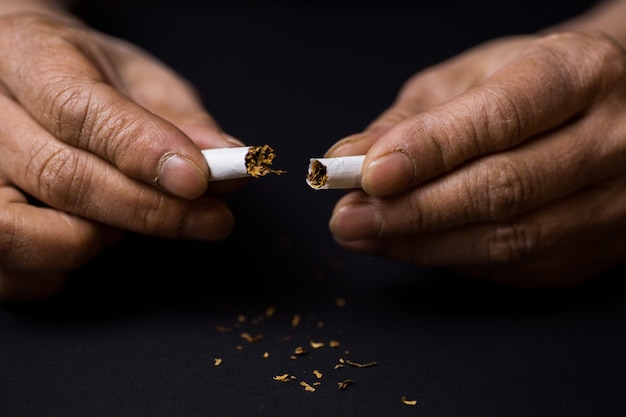 Closeup shot of a cigarette cut in half-quitting smoking concept