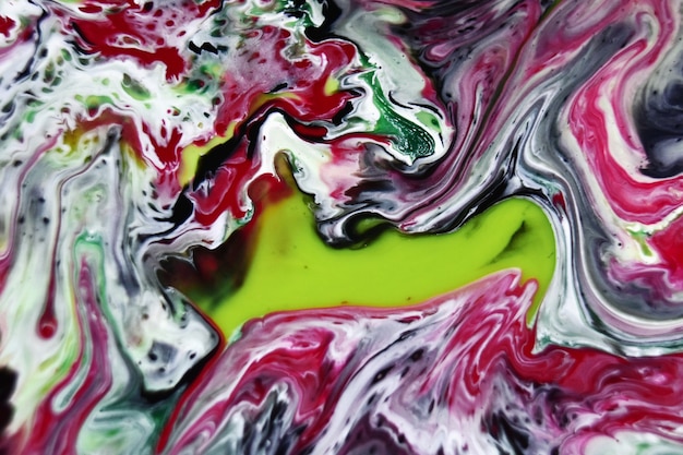Closeup shot of the colorful oil paints on the water surface