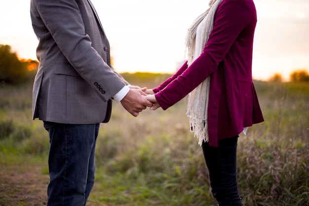 Closeup shot of a couple holding hands