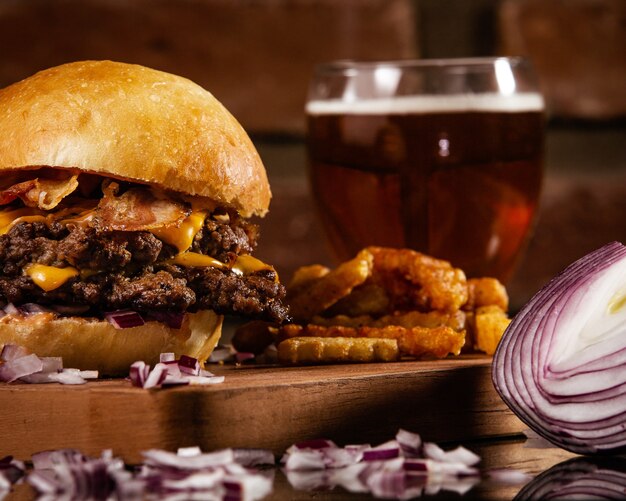 Closeup shot of a  delicious burger with beef, yellow cheese, and bacon