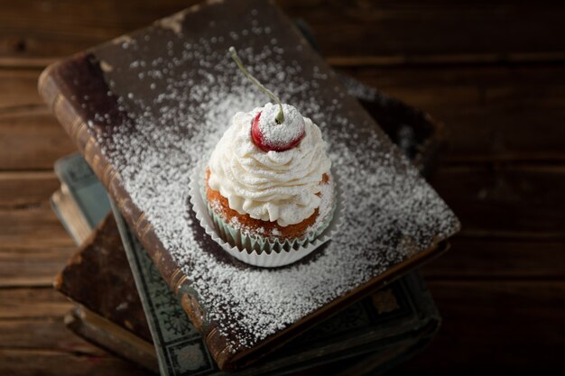 Closeup shot of a delicious cupcake with cream,