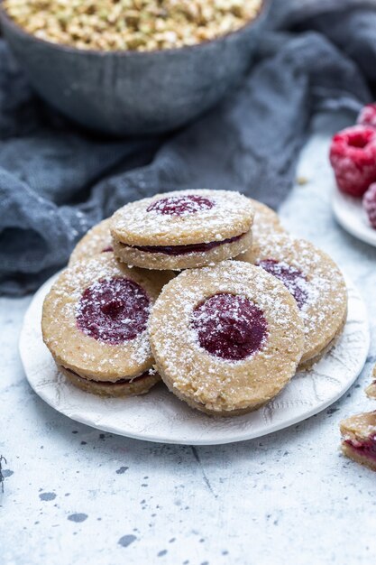 Closeup shot of delicious homemade cookies with frozen raspberries