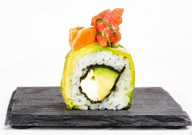 Closeup shot of delicious sushi roll on white background