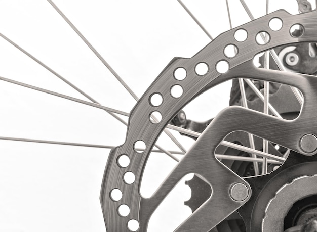 Free photo closeup shot of the details on the metal rim and spokes on the tire of a bicycle