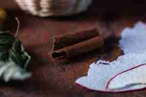 Free photo closeup shot of dried autumn leaves on a dark brown table